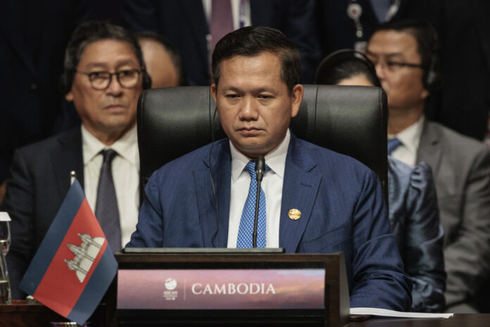 Cambodia police seek Thai extradition of critic of the govt’s trade negotiators